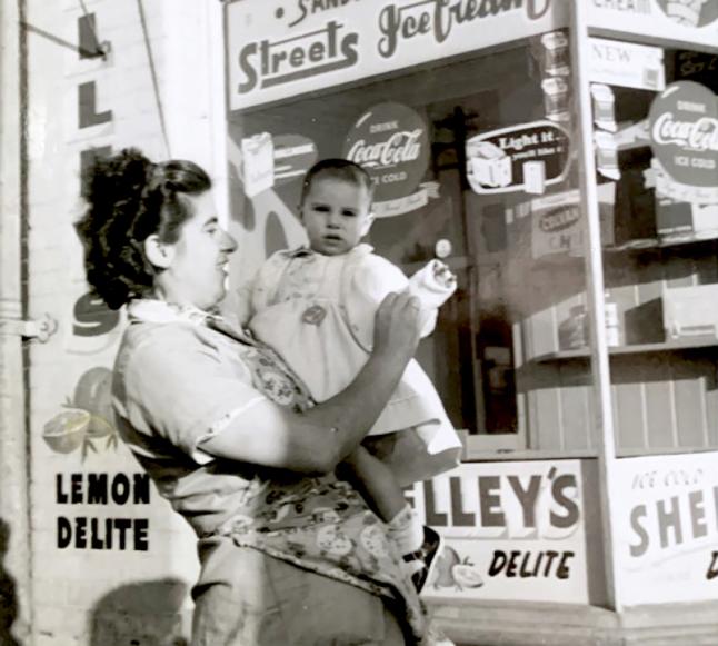 Evdokia Kokkinakos and daughter, Maria, outside of family business, Alexandria, Sydney, 1962