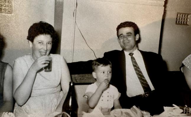 Asimo Nikolakopoulos and her husband, Andreas, with their son Nick. Paddington Town Hall, Sydney. c.1961.