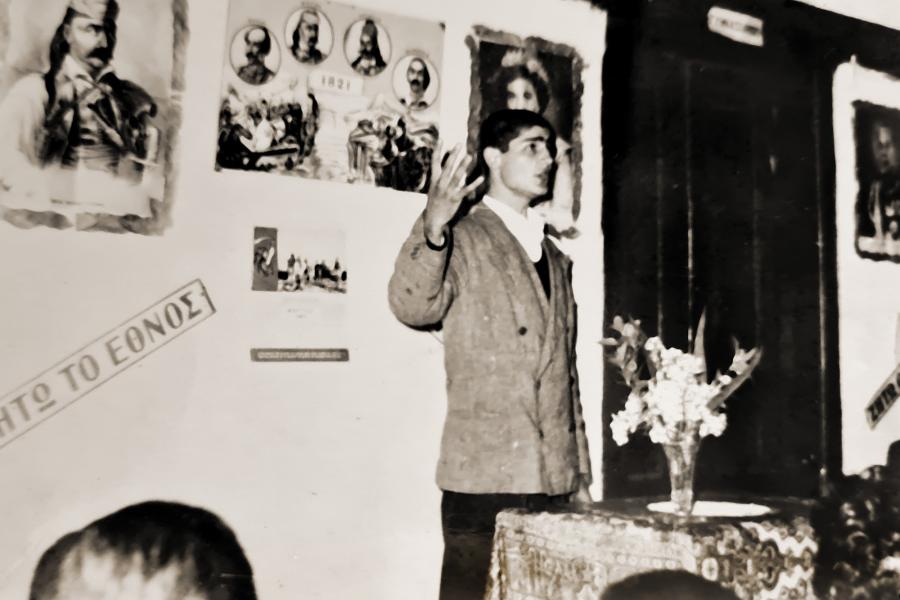 A person speaking to others