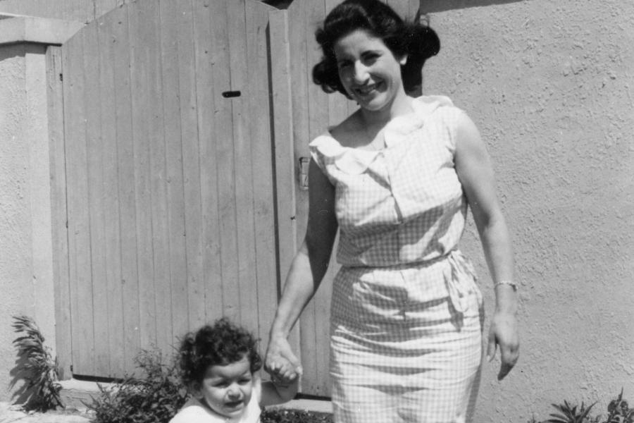 A person walking with a small child