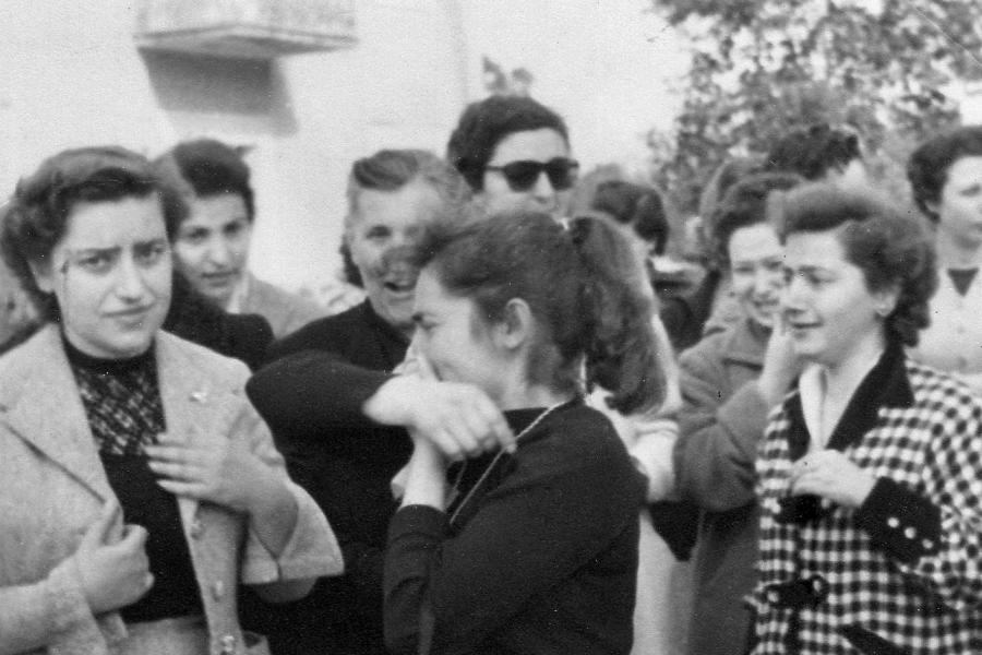 A group of people around one crying person