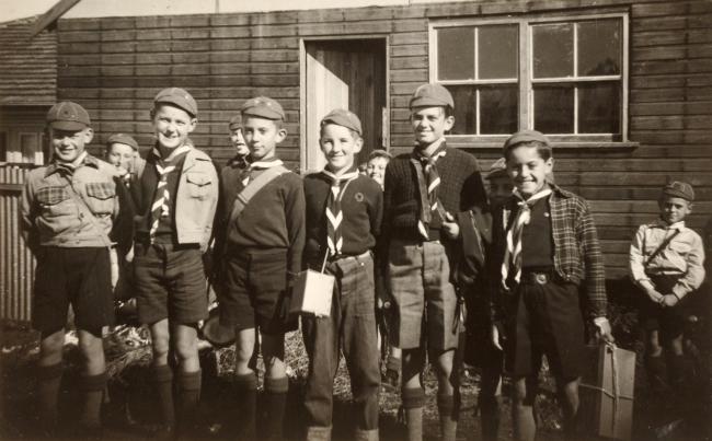 A group of children wearing scouting uniforms