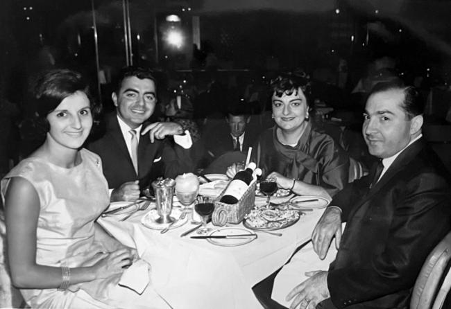 Two couple having dinner in a club