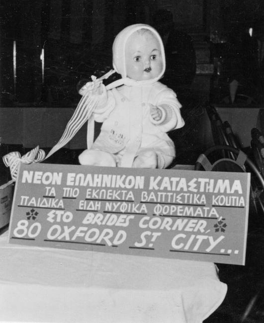 A baby on top of a sign