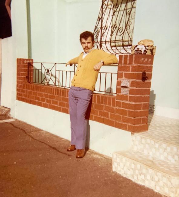 A person leaning on a railing