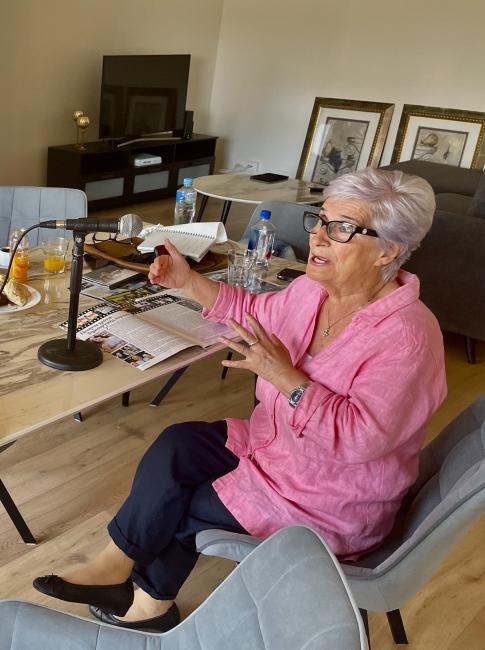 A person is sitting at a table talking