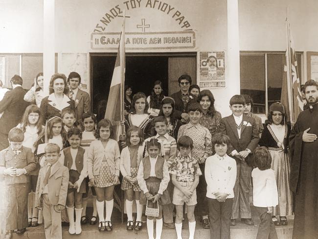 A group of children in front of a building