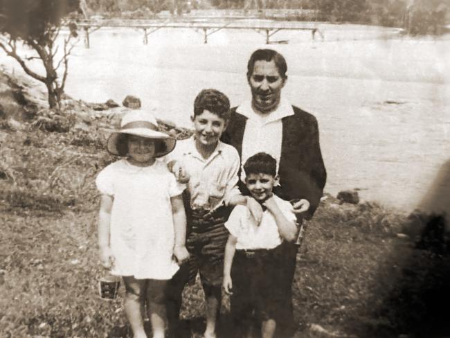 A family on a river bank