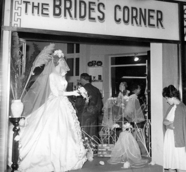 A shop window displaying a wedding dress