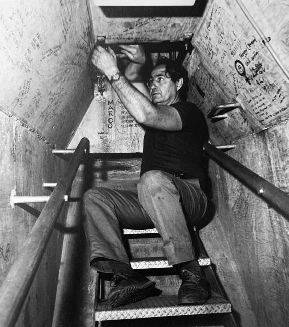 A person on stairs in a tunnel