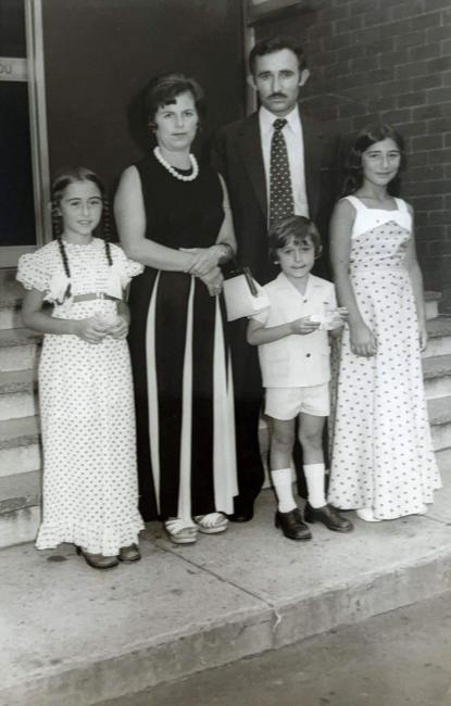 A family standing together for a photograph