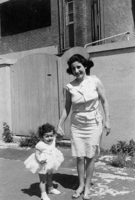 A person walking with a small child